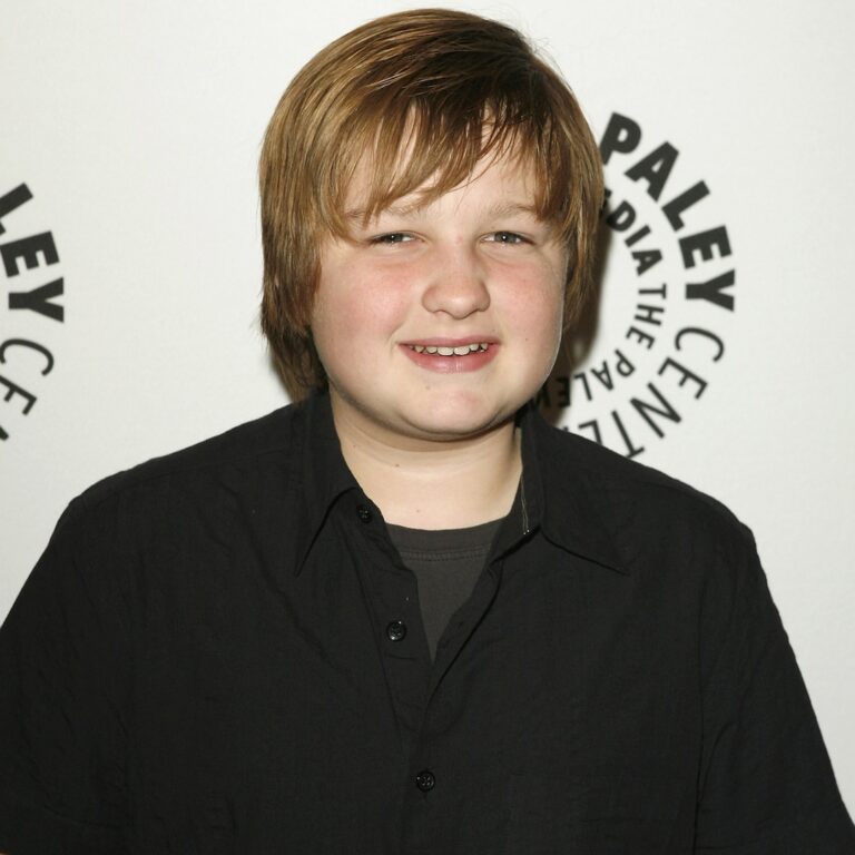 Two and a Half Males’s Angus T. Jones Steps Out With a Flip Cellphone